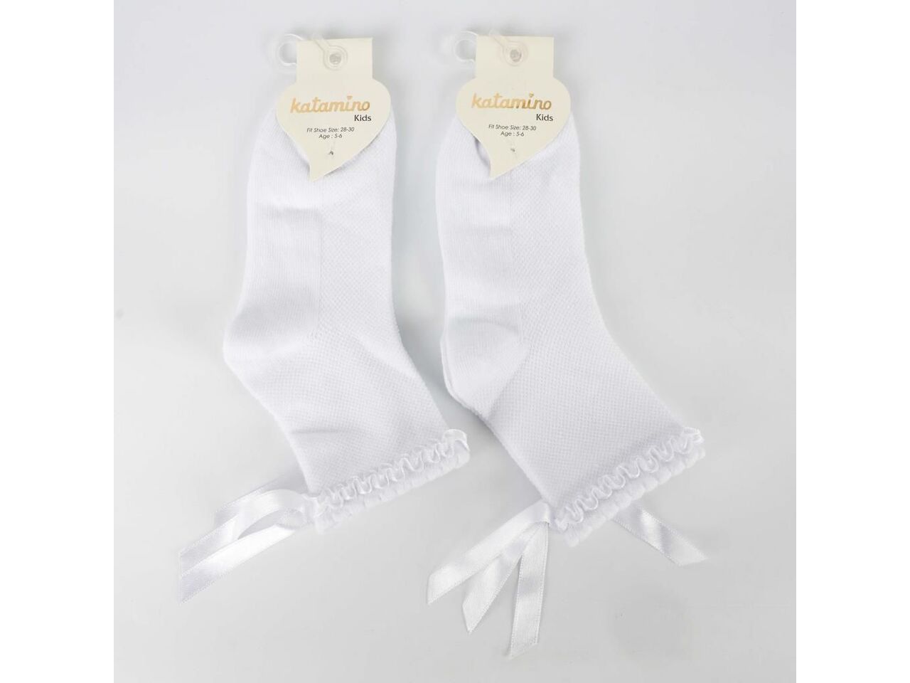 Baltos mergaičių kojinės